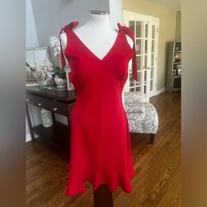 Red dress with ruffled hem and ties at the shoulders size medium